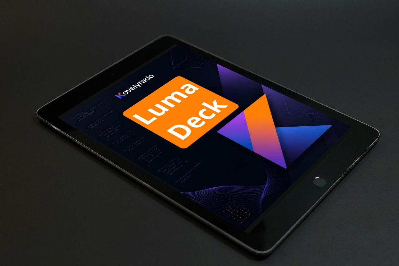 A black tablet device shown at an angle on a dark surface, displaying the Koyepino Luma Deck app interface on its screen.